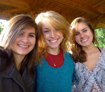 A group of friends smiles at the camera.